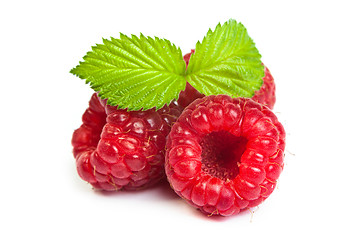 Image showing Bunch of a red raspberry on a white background. Close up macro s