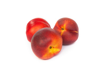 Image showing Three fresh nectarines on white