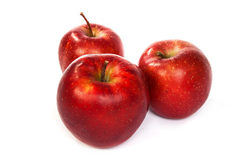 Image showing Three shiny red apples isolated on white