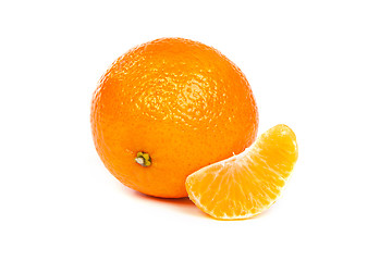 Image showing Ripe tangerine or mandarin with slices on white