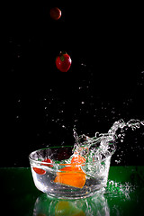 Image showing fruit splash into the water