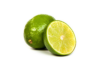 Image showing One whole lime and one half lime on white