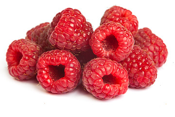 Image showing Bunch of a red raspberry on a white background. Close up macro s