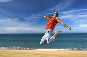 Image showing Jumping on the beach