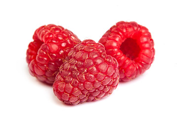 Image showing Bunch of a red raspberry on a white background. Close up macro s