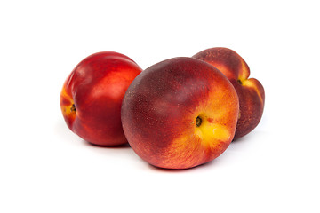 Image showing Three fresh nectarines on white