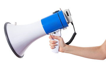 Image showing A woman is holding a loudspeaker