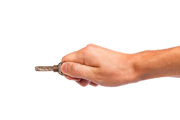 Image showing Male hand holding a key to the house