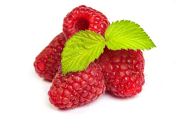 Image showing Bunch of a red raspberry on a white background. Close up macro s