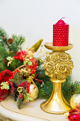 Image showing A fireplace mantle is decorated for Christmas with garland, ligh