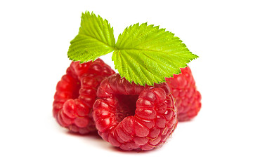 Image showing Bunch of a red raspberry on a white background. Close up macro s