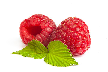 Image showing Bunch of a red raspberry on a white background. Close up macro s