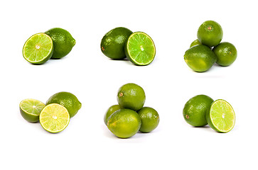 Image showing set of whole limes and half limes isolated on a white