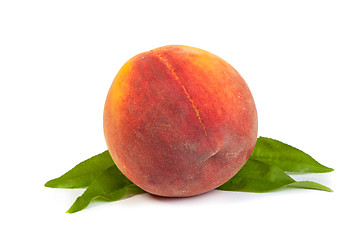 Image showing Three perfect, ripe peaches with a half  and slices isolated on 