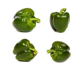 Image showing set of green sweet  bell peppers isolated on white