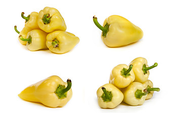 Image showing set of yellow bell peppers isolated on white