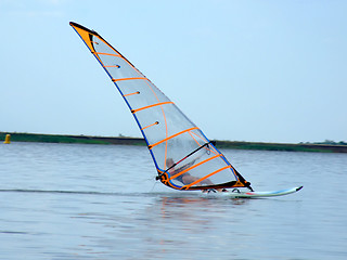 Image showing windsurfer on waves of a gulf in the afternoon