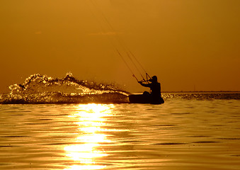 Image showing Silhouette of a kitesurf on a gulf on a sunset