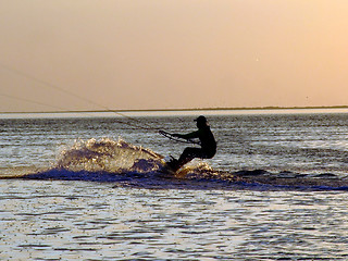Image showing Silhouette of a kitesurf on a gulf on a sunset 2