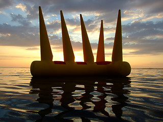 Image showing Greater bright inflatable toy on water on a sunset 2
