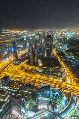 Image showing Dubai downtown night scene with city lights,