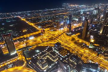 Image showing Dubai downtown night scene with city lights,