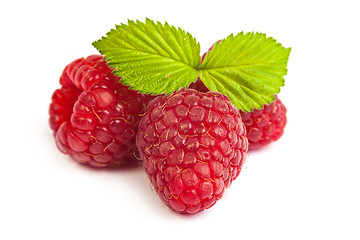 Image showing Bunch of a red raspberry on a white background. Close up macro s