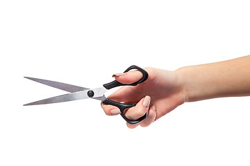 Image showing Hand is holding scissors isolated