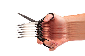 Image showing Hand is holding scissors isolated