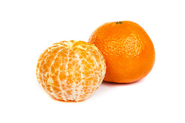 Image showing Ripe tangerine or mandarin with slices on white