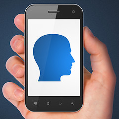 Image showing Finance concept: Head on smartphone