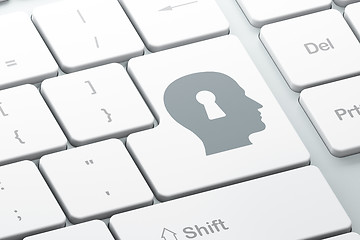 Image showing Protection concept: Head With Keyhole on computer keyboard backg