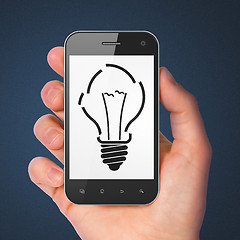 Image showing Finance concept: Light Bulb on smartphone