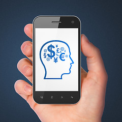 Image showing Education concept: Head With Finance Symbol on smartphone