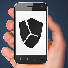 Image showing Security concept: Broken Shield on smartphone