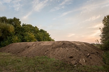 Image showing Large pile of soil under blue sky