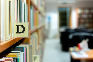 Image showing Library bookshelf closeup with letter