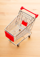 Image showing Trolley on wooden background