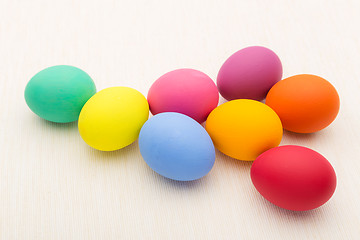Image showing Colourful easter egg over white linen background