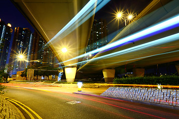 Image showing Fast moving car light in city at night