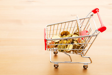 Image showing Trolley with gold coin