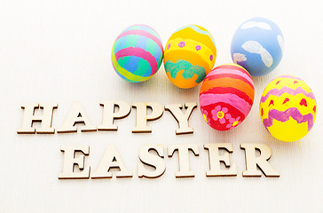 Image showing Colourful design easter egg and wooden word