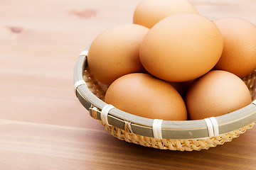 Image showing Brown egg in basket