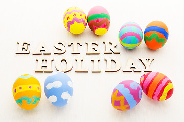 Image showing Pattern easter egg with wooden text