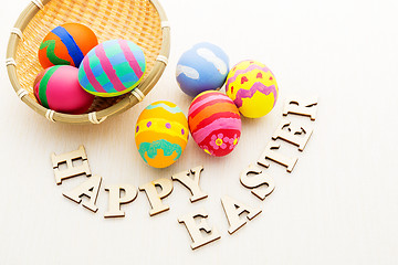 Image showing Colourful design easter egg with wooden word