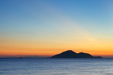 Image showing Sunset seascape with small island