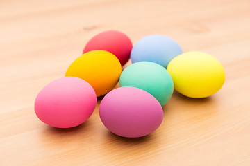 Image showing Painted easter egg over wooden background