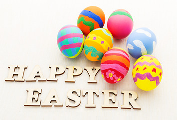 Image showing Colourful design easter egg and wooden letter