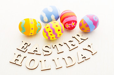Image showing Colourful patterm easter egg with wooden letter