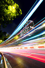 Image showing Fast moving car light on street